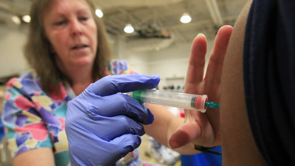  Nurse Susan Peel gives a whooping cough vaccination to a student at Inderkum High School in Sacramento. Calif., Monday, Sept, 19, 2011.  Friday was  the deadline for middle school and high school age students to show proof of vaccination.  (AP Photo/Rich Pedroncelli, file) 