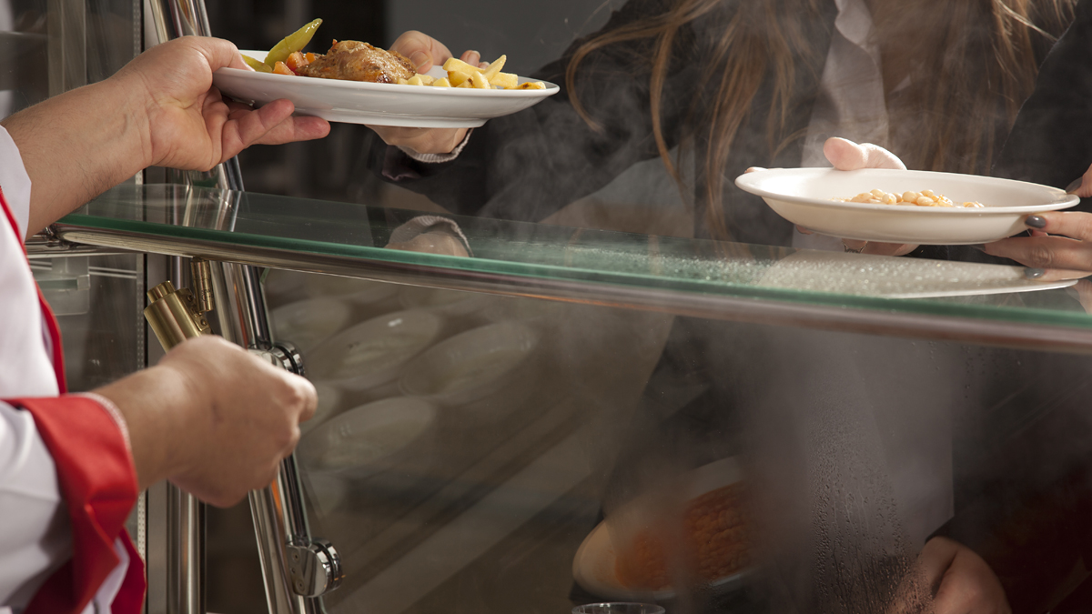 Students wait in a cafeteria line for school lunch.  (<a href=