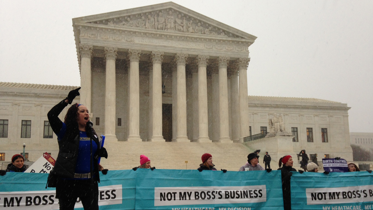  Kimberly Inez McGuire, with National Latina Institute for Reproductive Health, leads a protest chant for people siding with the government's position in the contraception mandate case. (Mary Wilson/WHYY) 