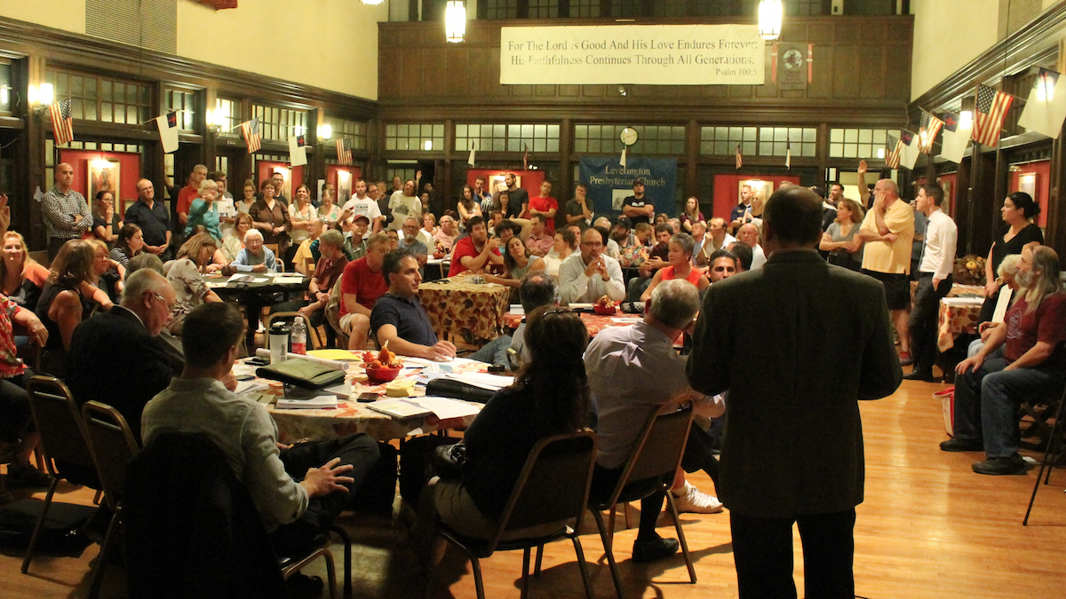  Residents raise their hands to weigh in on a proposal for a Wendy's along Ridge Ave. in Roxborough. (Matthew Grady/for NewsWorks) 