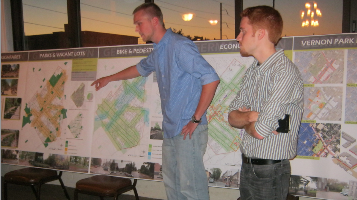  Philadelphia University students present plans at Monday night's eco-district meeting. (Alaina Mabaso/for NewsWorks) 