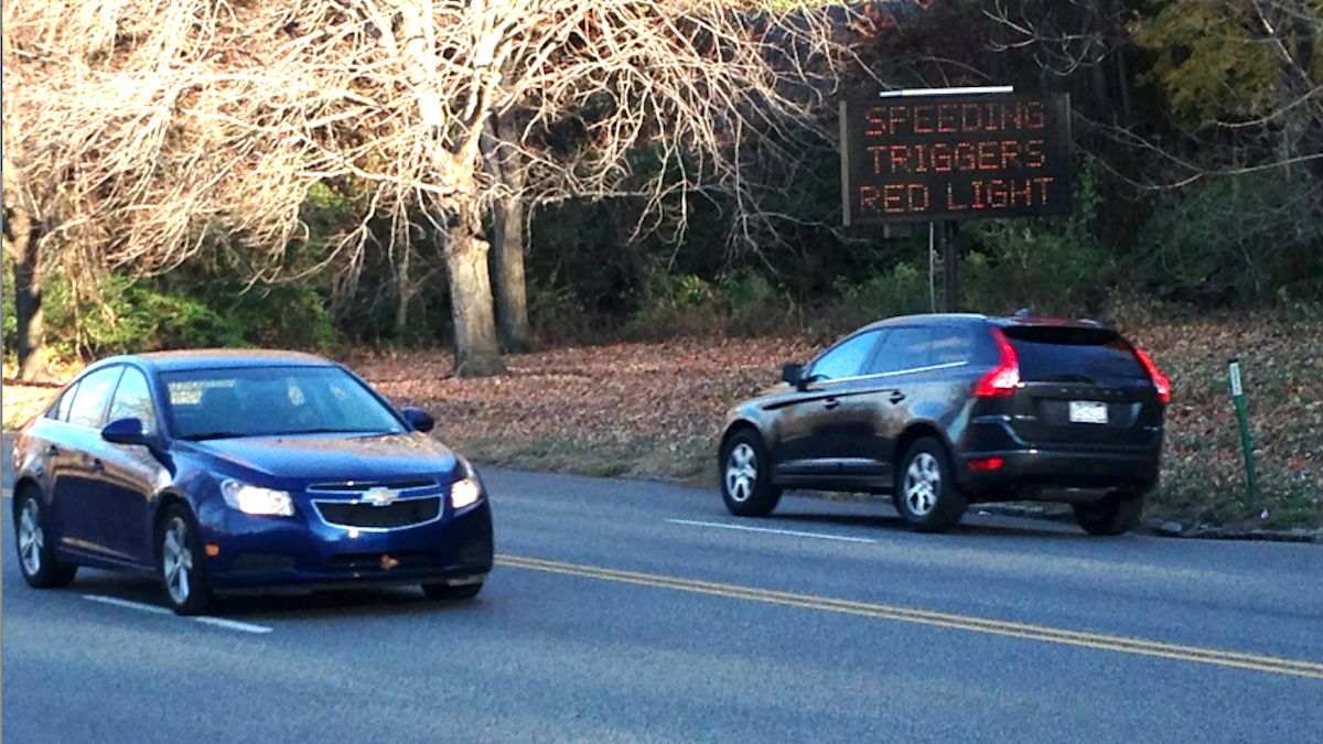  A view of the flashing 'Speeding Triggers Red Light Ahead' as seen during Tuesday's morning rush. (Brian Hickey/WHYY) 