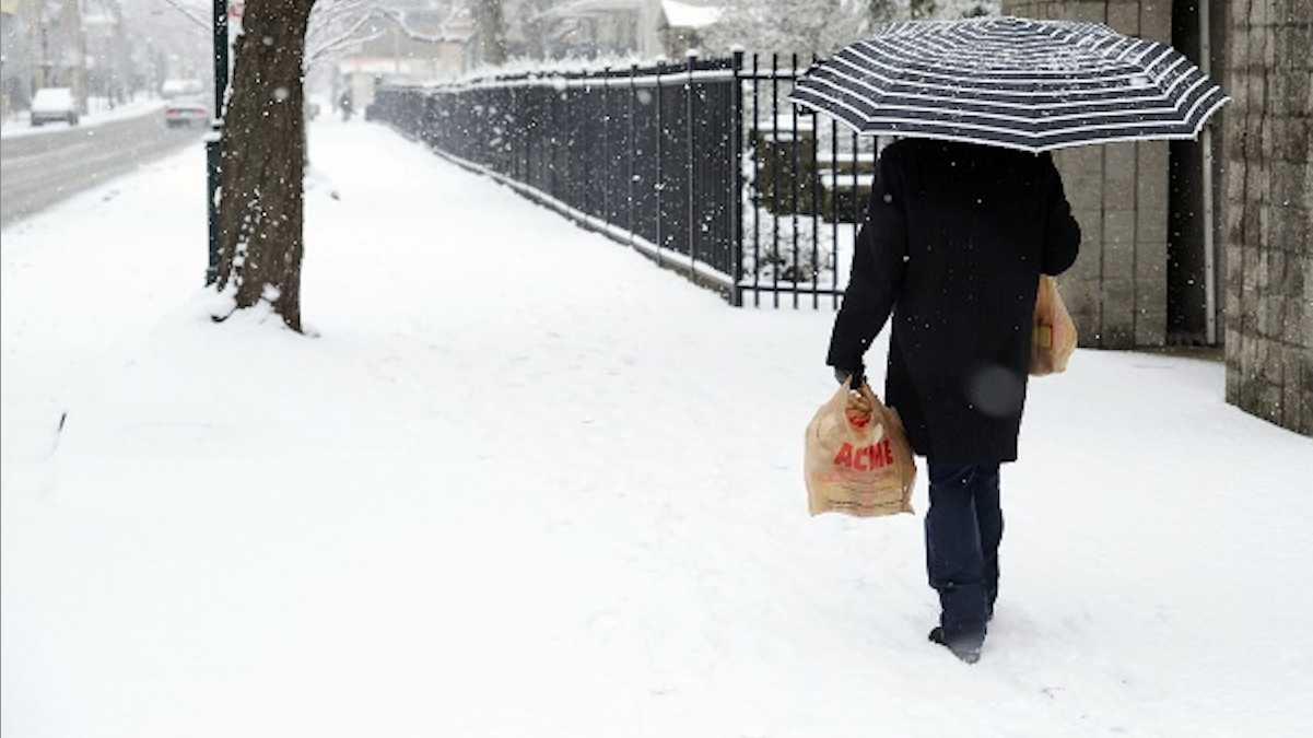  It snowed on Germantown Avenue last year, and it will snow on Germantown Avenue today, per weather reports. (NewsWorks file art) 