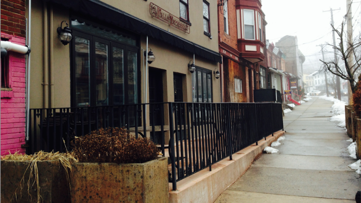 The patio outside Falls Taproom along Midvale Avenue was bolstered with a 2012 facade-improvement grant. Now, the owner seeks retroactive community support. (Brian Hickey/WHYY) 