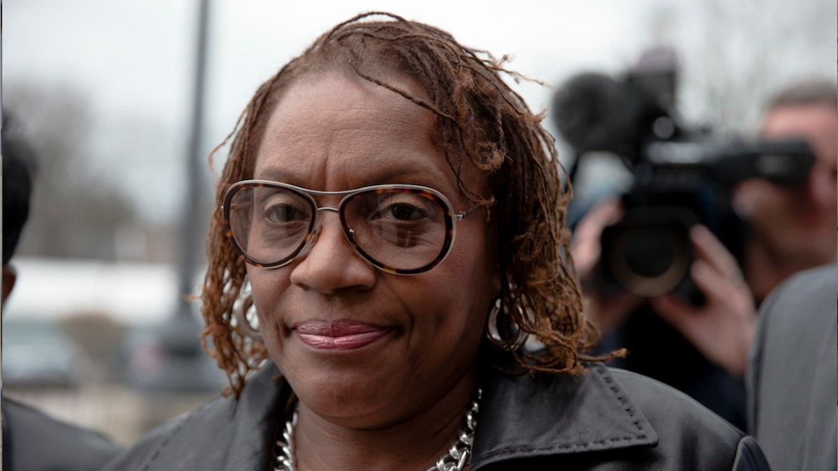  State Sen. Leanna Washington walks to the police station in Abington on Wednesday. State prosecutors filed charges alleging Washington used her staff to organize an annual political fundraiser on taxpayer time, using taxpayer resources. (AP Photo/Matt Rourke) 