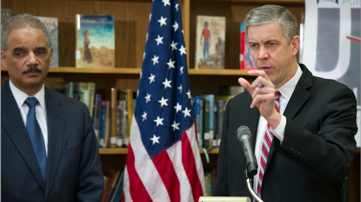  Education Secretary Arne Duncan speaks as Attorney General Eric Holder looks on as they discuss the importance of universal access to preschool and the need to reduce 