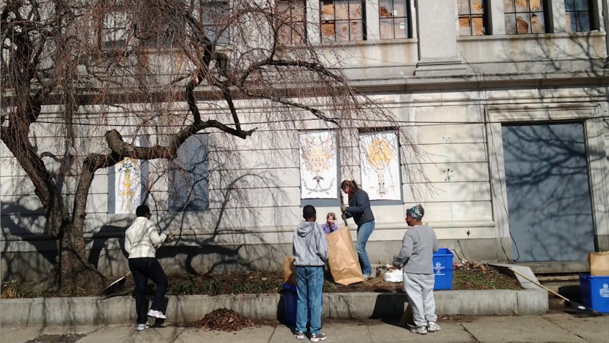  Volunteers gathered at Germantown Town Hall on Saturday to rake and bag leaves, sticks and winter debris, tossing piles of discarded bottles and cans into blue recycling bins. (Alaina Mabaso/for NewsWorks) 