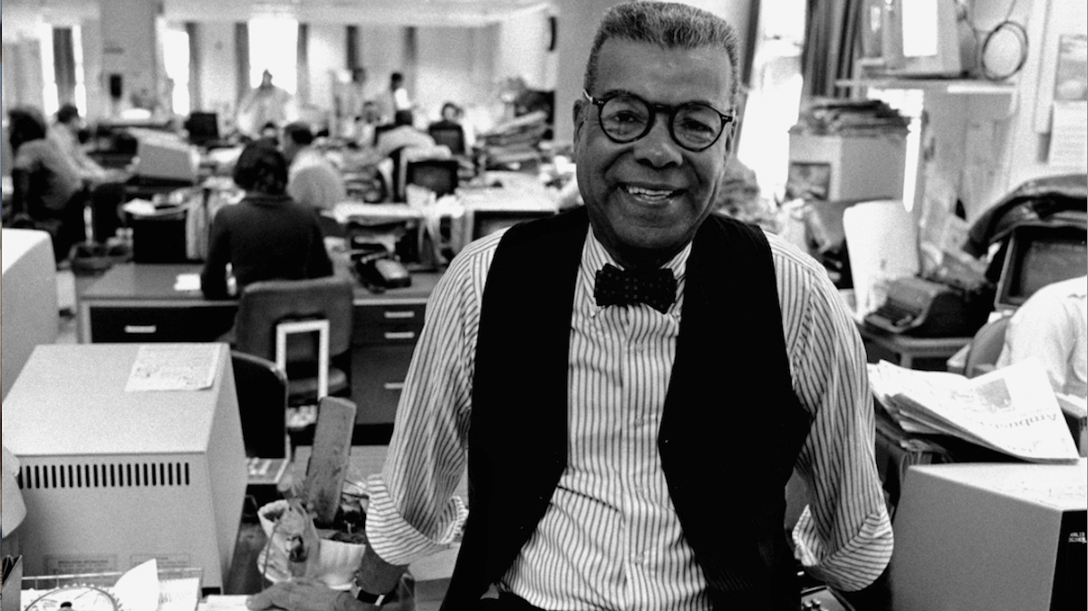 In this 1984 file photo, newspaper columnist Chuck Stone poses in the newsroom of the Philadelphia Daily News. Longtime journalist and educator Charles Sumner 