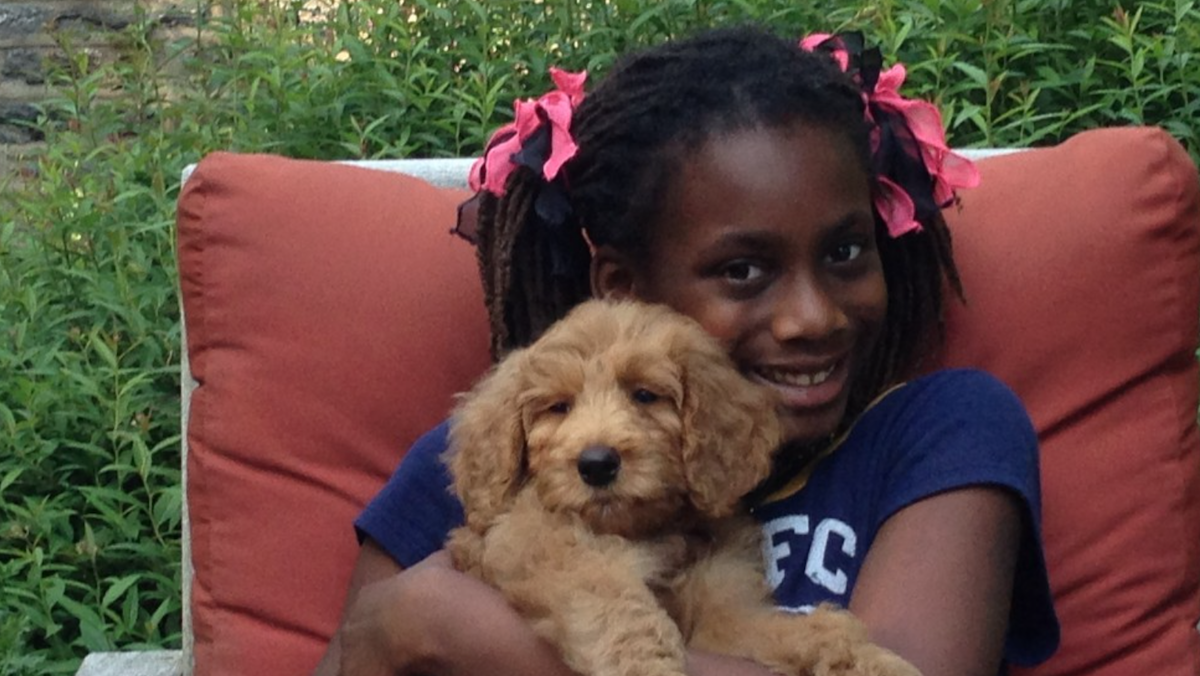  Jen Bradley's daughter with their dog when it was a puppy. (Courtesy of Jen Bradley) 
