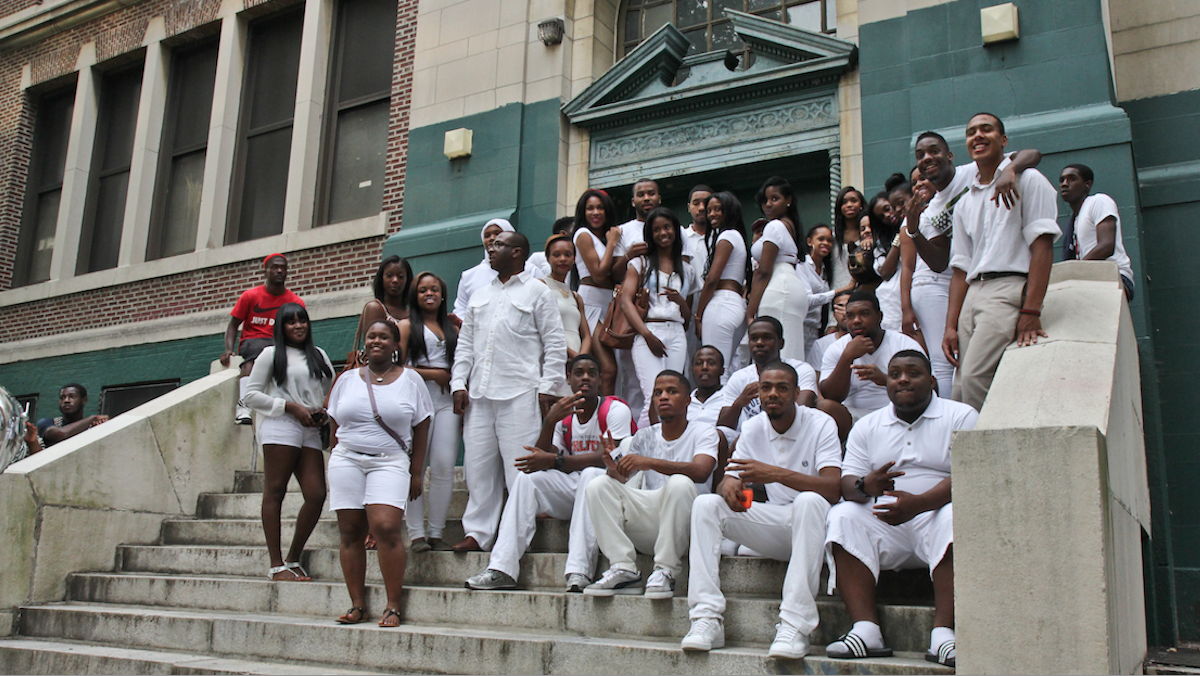  On June 18, 2013, members of the last class posed outside Germantown High School before taking a ceremonial last lap around the building. (Bas Slabbers/for NewsWorks) 