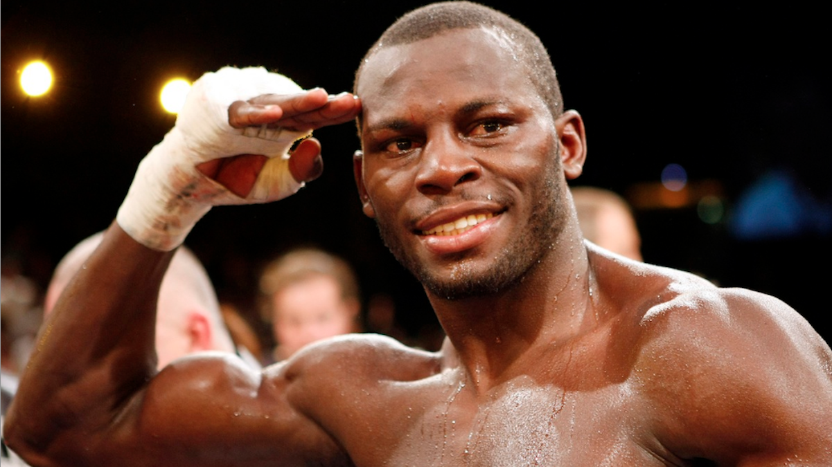  Steve 'USS' Cunningham from the USA, picture, salutes after a victory in the boxing ring. He and his family will soon be honored by Philadelphia City Council. (AP Photo/Martin Meissner) 