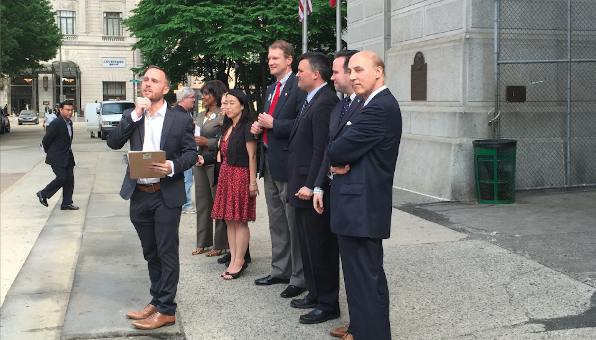  The 5th Square PAC introduces its slate of endorsed council candidates near what has become known as the 'City Hall Parking Lot' on Tuesday. (Brian Hickey/WHYY) 