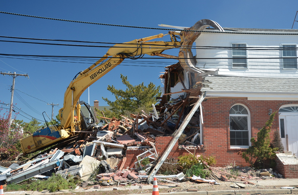  Heavy machinery demolishing the Mantoloking municipal building Monday morning. (Photo courtesy of Ed O'Malley/Bay Head & Mantoloking Today) 