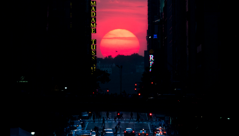  The sun sets along 42nd Street in Manhattan during an annual phenomenon known as 