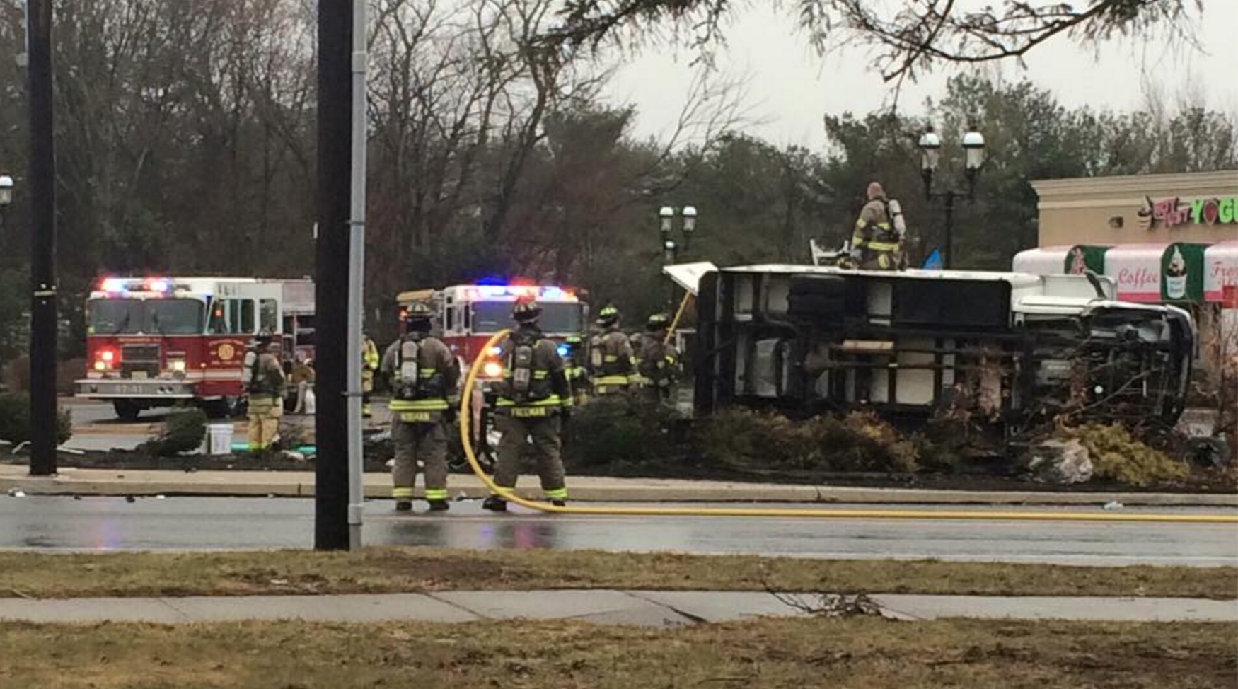 Firefighters on the scene of a crash involving an overturned truck on Route 9 in Stafford this afternoon. (Photo courtesy of Roman Isaryk‎)