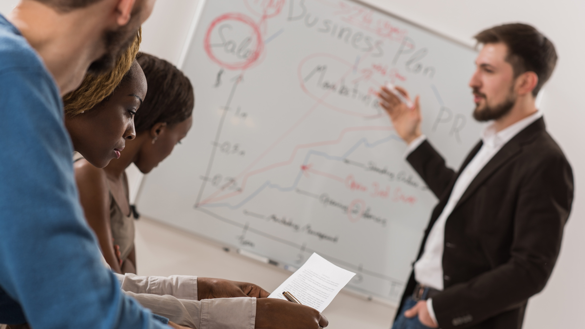  (<a href='http://www.shutterstock.com/pic-232601662/stock-photo-business-meeting-at-office-handsome-man-presenting-charts-on-whiteboard-to-team-multi-ethnic.html?src=csl_recent_image-1&ws=1'>Business meeting</a> image courtesy of Shutterstock.com) 