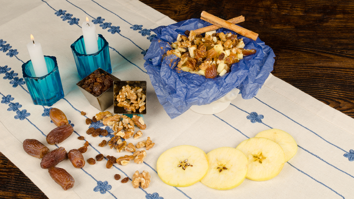  (<a href='http://www.shutterstock.com/pic-164232686/stock-photo-haroset-served-on-a-festive-table-surrounded-by-its-ingredients.html'>Charoses with ingredients image</a> courtesy of Shutterstock.com. This is not, it should be noted, Aunt Millie's charoset.) 