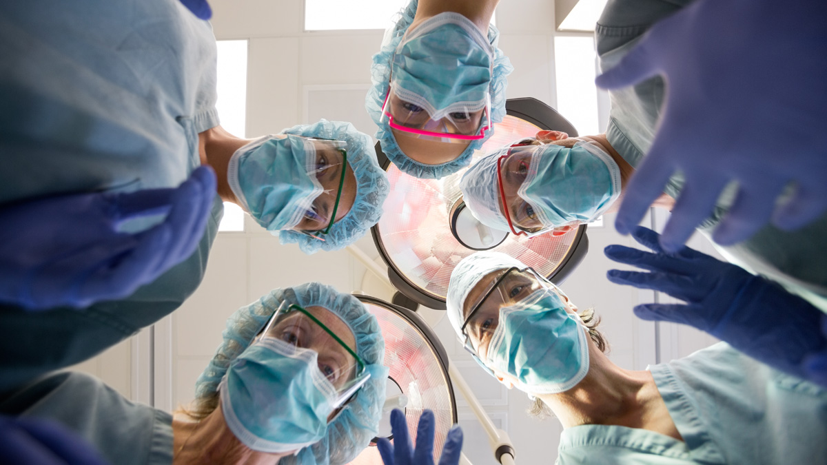  (<a href='http://www.shutterstock.com/pic-164763224/stock-photo-directly-below-portrait-of-multiethnic-medical-team-with-masks-and-scrubs-in-operation-room.html'>Medical team image</a> courtesy of Shuterstock.com) 