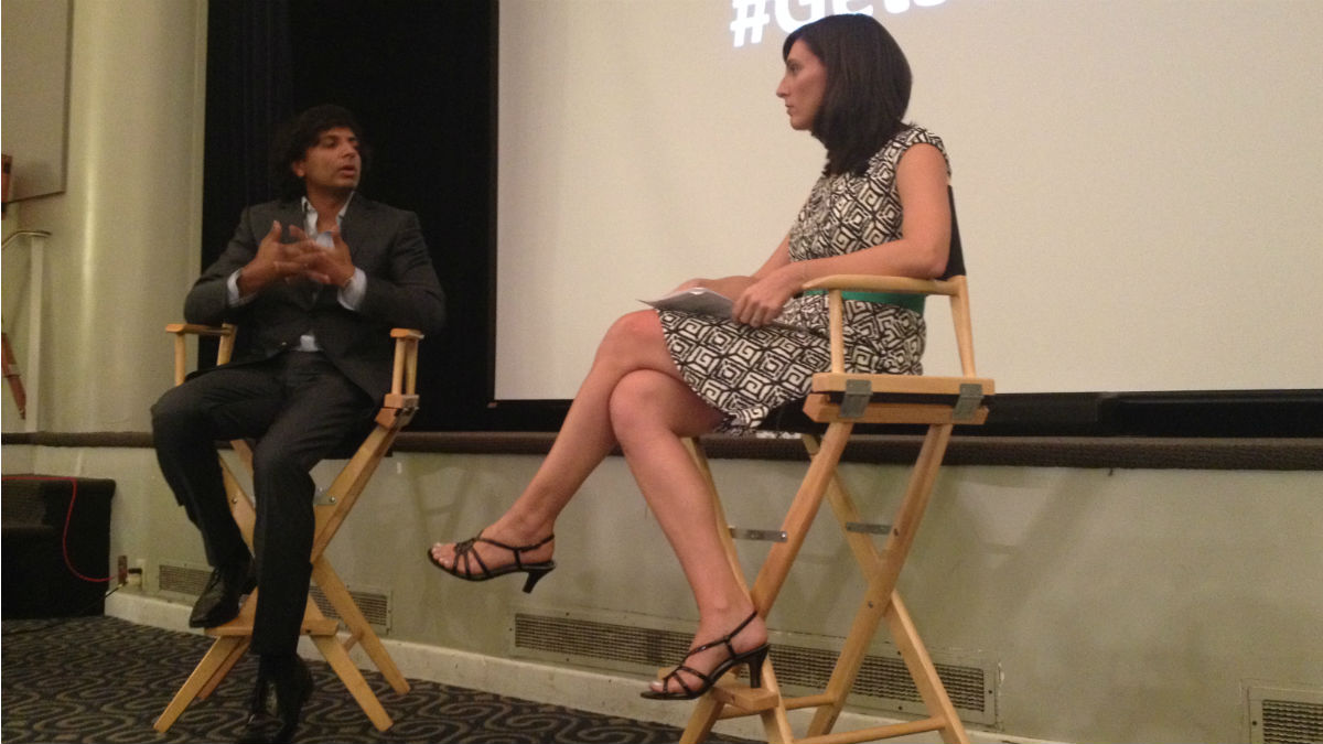  M. Night Shyamalan (left) talks education with Delaware teacher of the year Megan Szabo. (Avi Wolfman-Arent, NewsWorks/WHYY) 