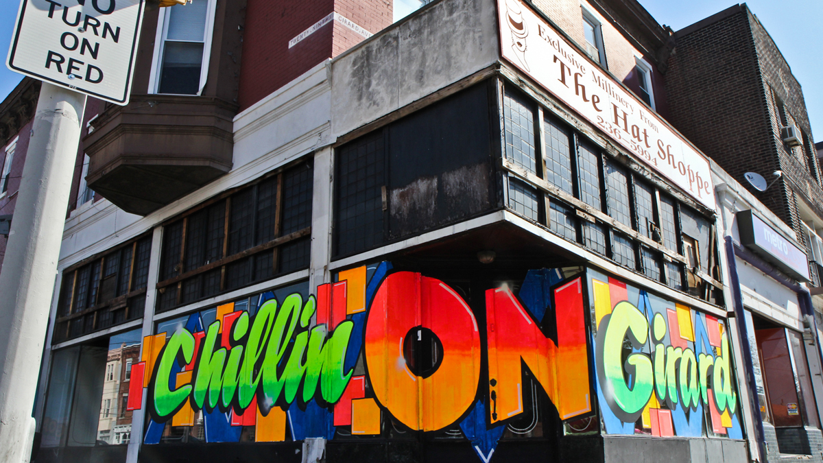  Artist Stephen Powers and developer David Waxman are changing the landscape of Girard Avenue one hand-painted sign at a time. (Kimberly Paynter/WHYY)  