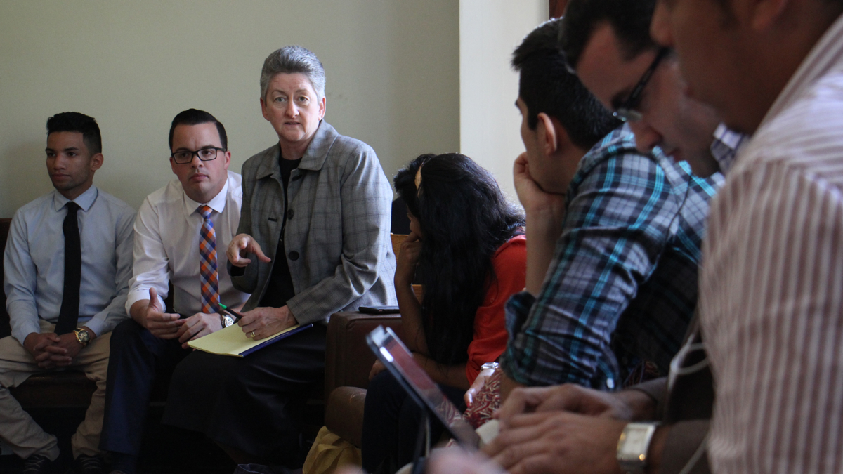 Sister Helen Cole of Guadalupe Family Services in Camden hosts a meeting of gang violence interventionists from South and Central America. (Emma Lee/WHYY)