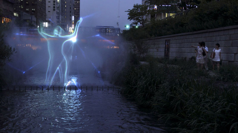  A laser light display is shown in misting fountains of the Cheonggyecheon river in central Seoul, South Korea. (AP Photo/Wally Santana) 