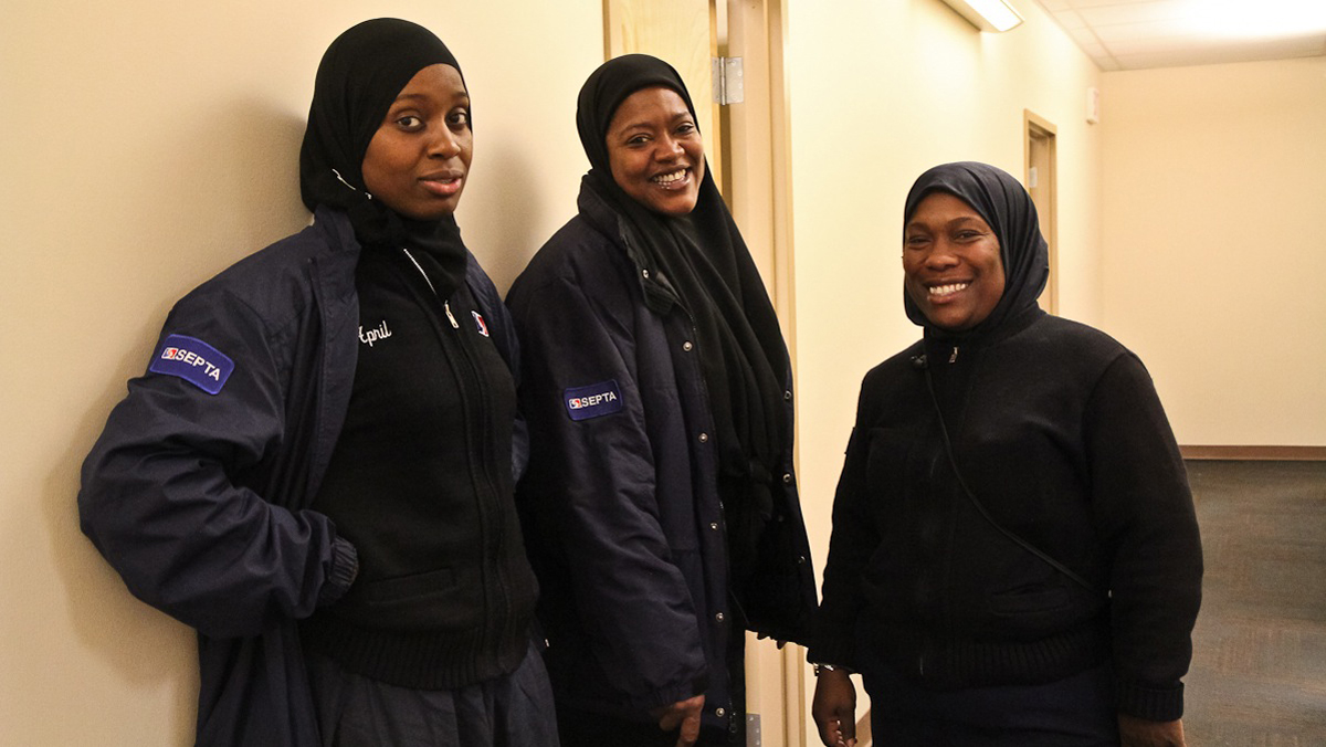  SEPTA bus drivers April Barnes, Rhonda Blackston and Keasha Paulhill say that long skirts do not hinder their ability to do their jobs. (Kimberly Paynter/WHYY) 