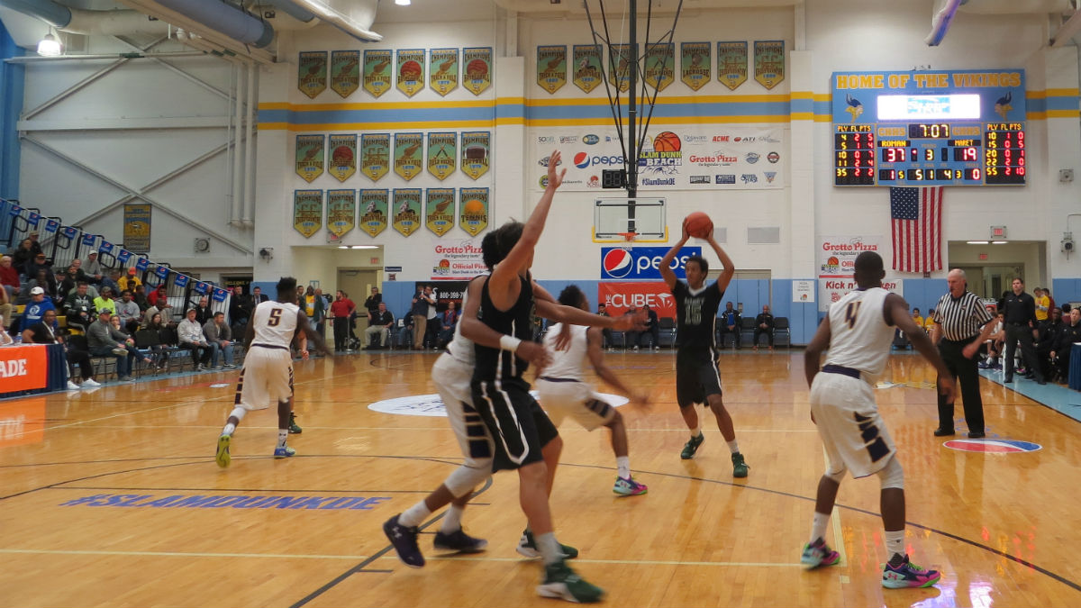  Maret School of Washington D.C. (black jerseys) takes on Phladelphia's Roman Catholic High School (white) during day two of the Slam Dunk to the Beach basketball tournament. (Avi Wolfman-Arent, NewsWorks/WHYY) 