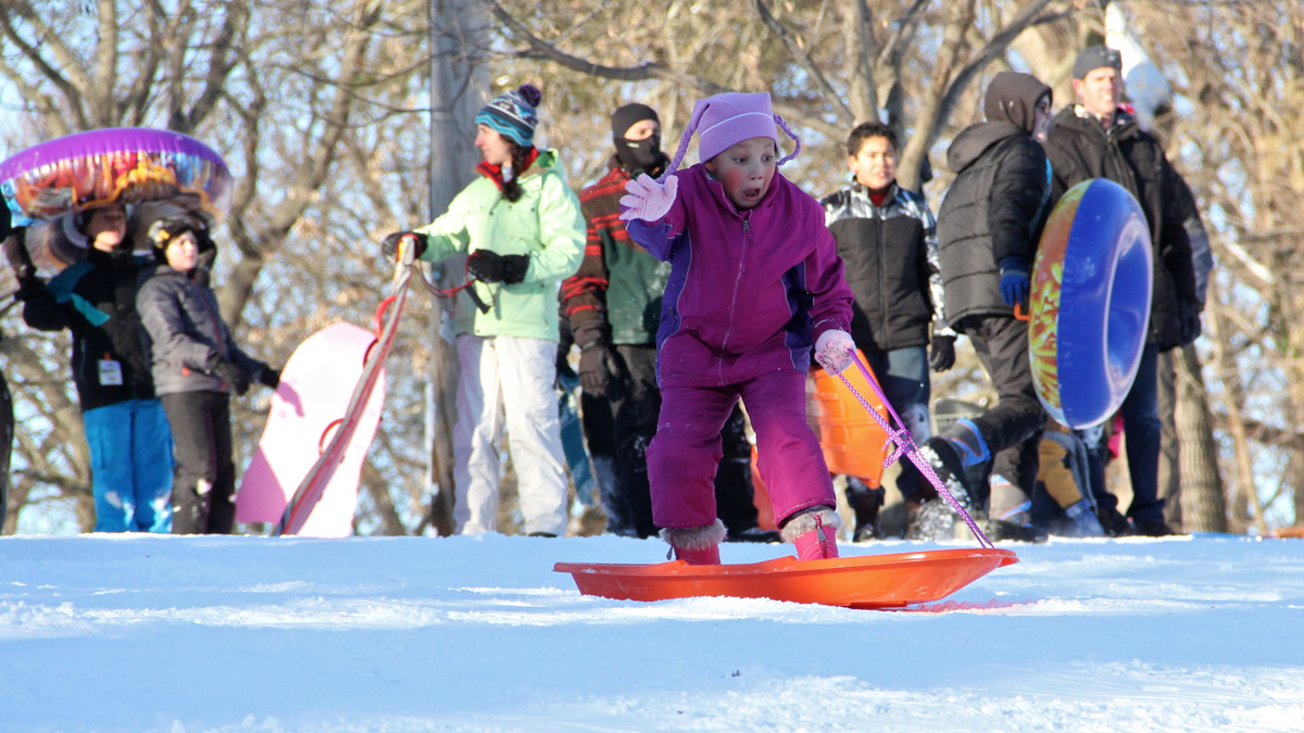  Sledders wait their turns at the top of Stokes Hill in Moorestown, N.J., after last week's snowfall. (Emma Lee/for NewsWorks, file) 