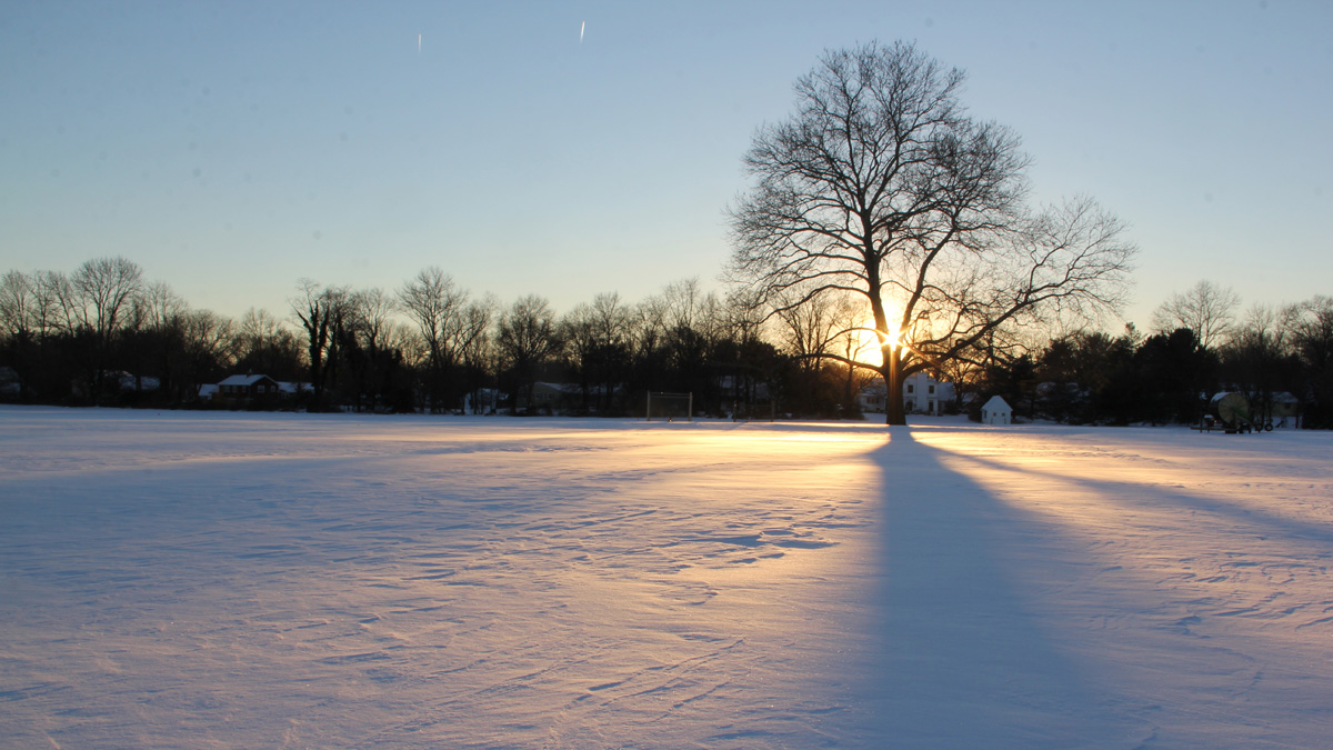  The sun sets over an unbroken field of snow. (Emma Lee/for NewsWorks, file) 