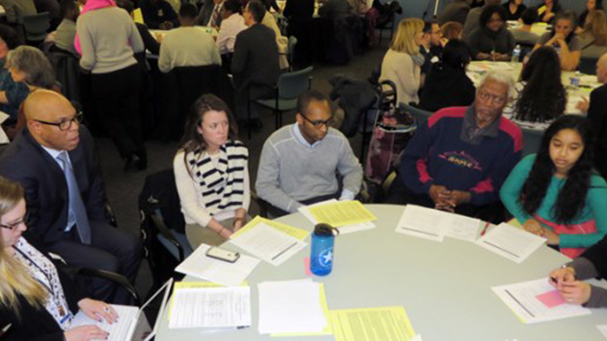  Superintendent William Hite (left) listens as community members discuss a proposed universal enrollment system during a School Reform Commission meeting (Photo courtesy of Bill Hangley Jr./Philadelphia Public School Notebook) 
