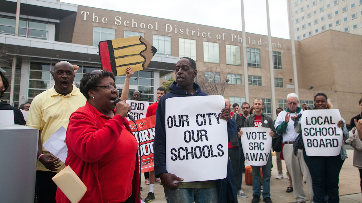 Protestors calling for the dissolution of the SRC gather outside district headqquarters. (Brad Larrison for Newsworks)