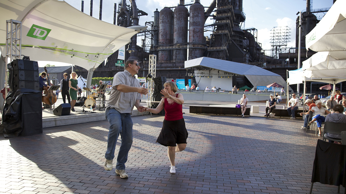 Jim Jacek and Kathy Fox dance during a free jazz performance outside of ArtsQuest and the Levitt Pavilion at SteelStacks