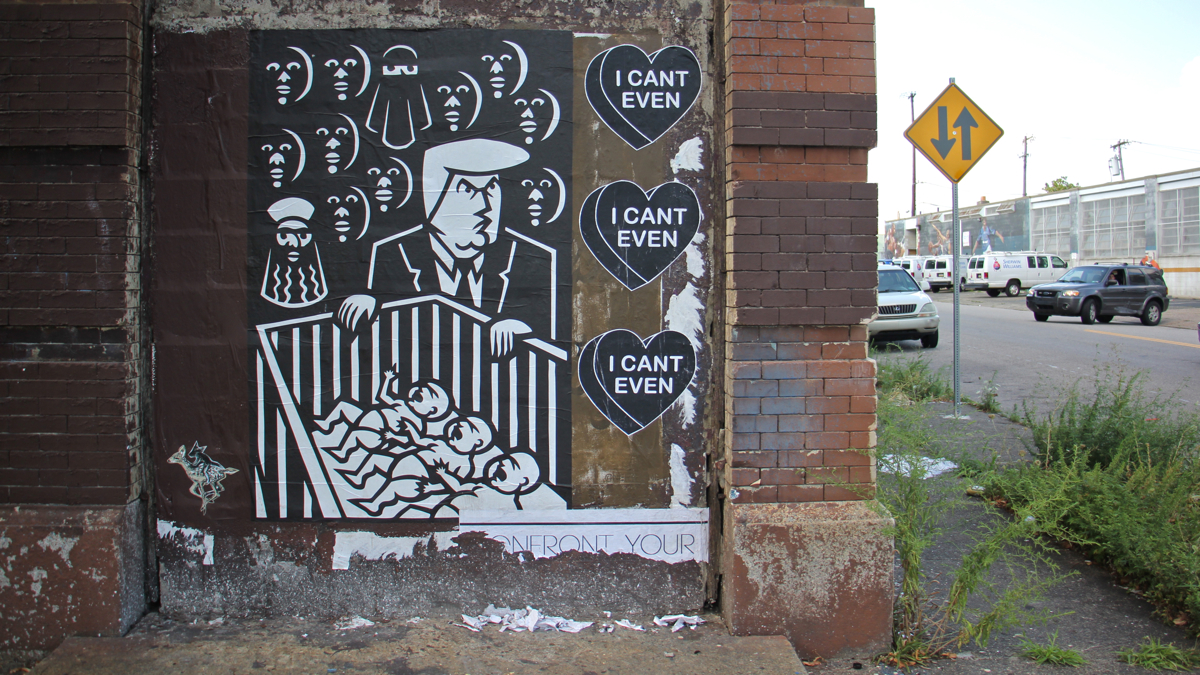 Joe Boruchow's mysterious print featuring presidential candidate Donald Trump is pasted beside Amber Lynn's candy hearts at 9th and Spring Garden streets. (Emma Lee/WHYY)