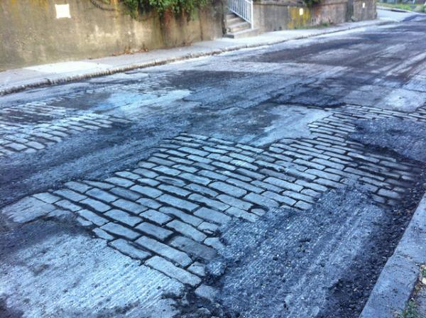  Public Works Director Mike Gable says 550 of the city's 1042 miles of roadway need attention. This spring and summer, they'll tackle 40 miles.  (Photo via Flicker by artnoose) 