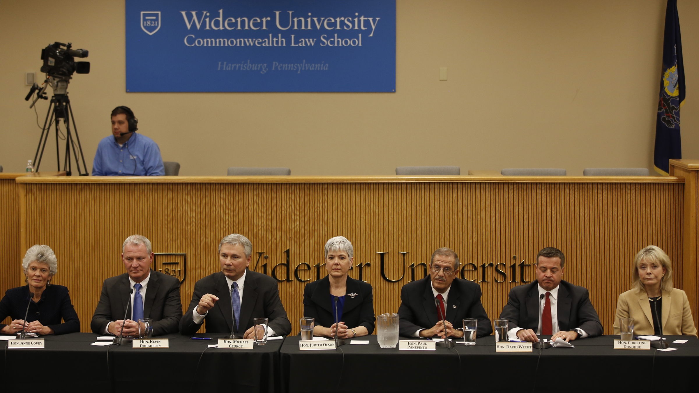  State Superior Court judge Christine Donohue, from right, state Superior Court Judge David Wecht, Philadelphia Judge Paul Panepinto, state Superior Court Judge Judith Olson, Adams County, Pa., Judge Michael George, Philadelphia Judge Kevin Dougherty and state Commonwealth Court Judge Anne Covey participate in a Pennsylvania Supreme Court debate, Wednesday, Oct. 14, 2015, at the Widener University Commonwealth Law School in Harrisburg, Pa. On Nov. 3, voters will fill three vacancies on the seven-member state Supreme Court. (AP Photo/Matt Slocum) 