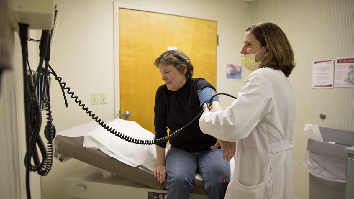 Dr. Mary Monari-Sparks checks Suzanne Cloud's blood pressure at Cooper Medical Services in Cherry Hill