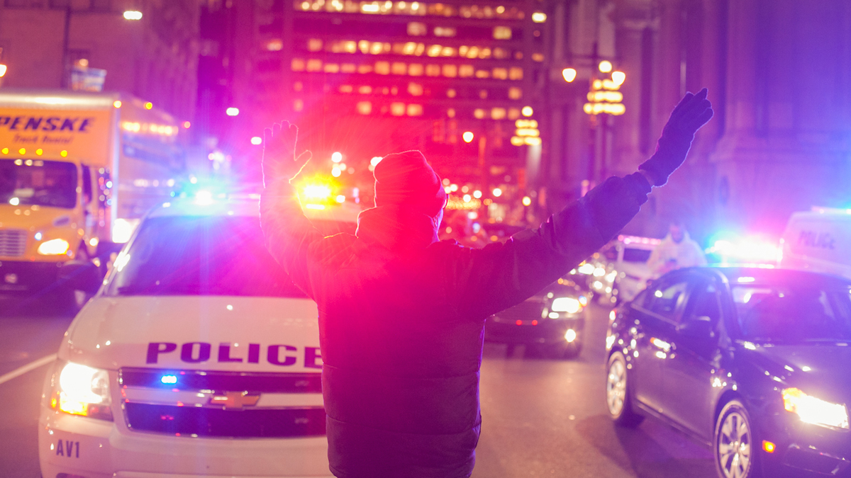 Protestors held up traffic around city hall Thursday evening as they called for the re-examing of the death of Brandon Tate-Brown at the hands of Philadelphia Police. (Brad Larrison for NewsWorks)