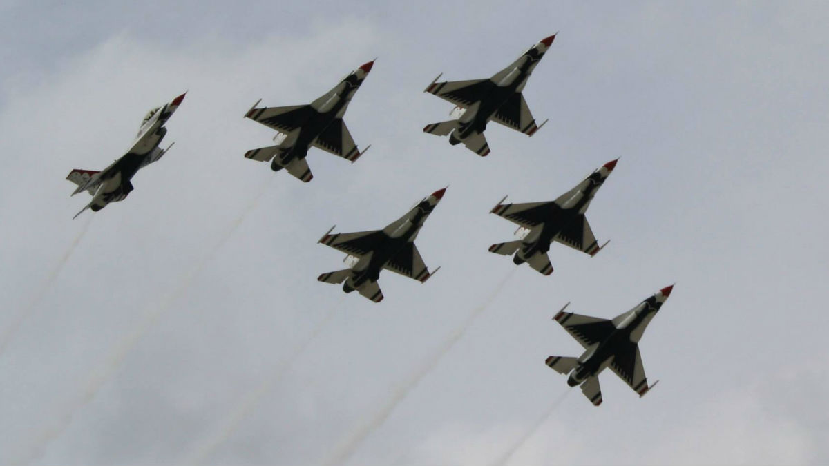 The U.S. Air Force Thunderbirds fly at Joint Base McGuire-Dix-Lakehurst in New Jersey in 2014. (Mark Eichmann/WHYY)