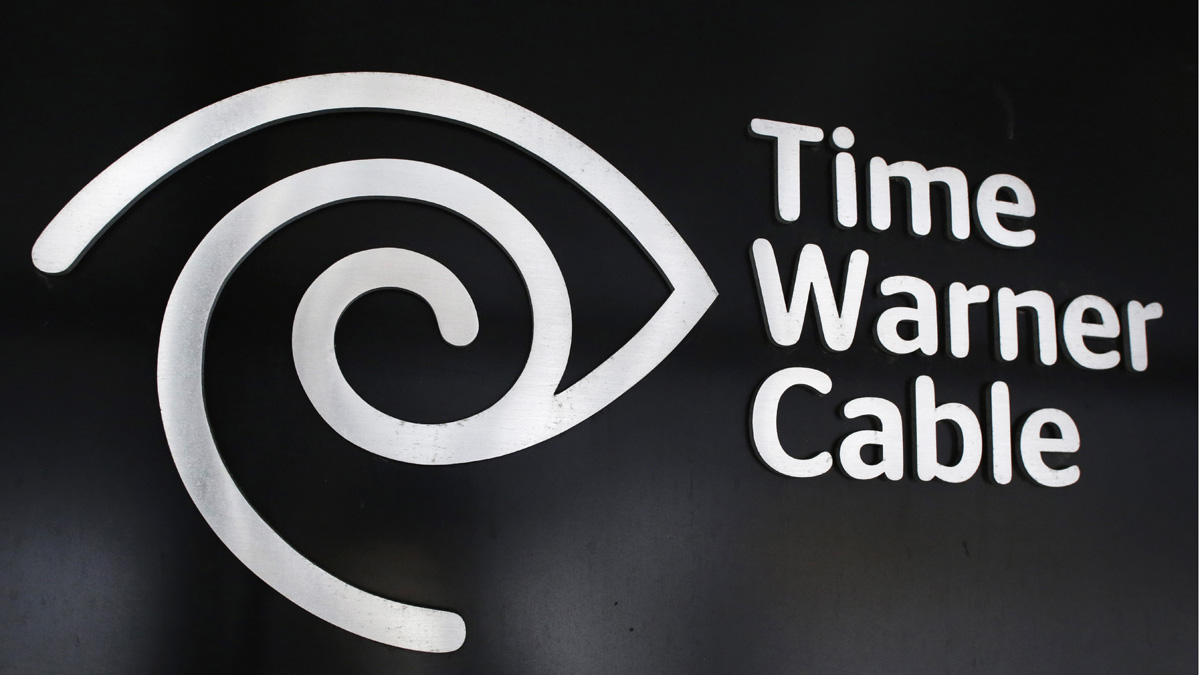 The Time Warner Cable corporate logo is displayed at a company store, Tuesday, May 26, 2015 in New York. Charter Communications is buying Time Warner Cable for $55.33 billion. And executives say they're confident regulators will allow the creation of another U.S. TV and Internet giant. (AP Photo/Mark Lennihan)