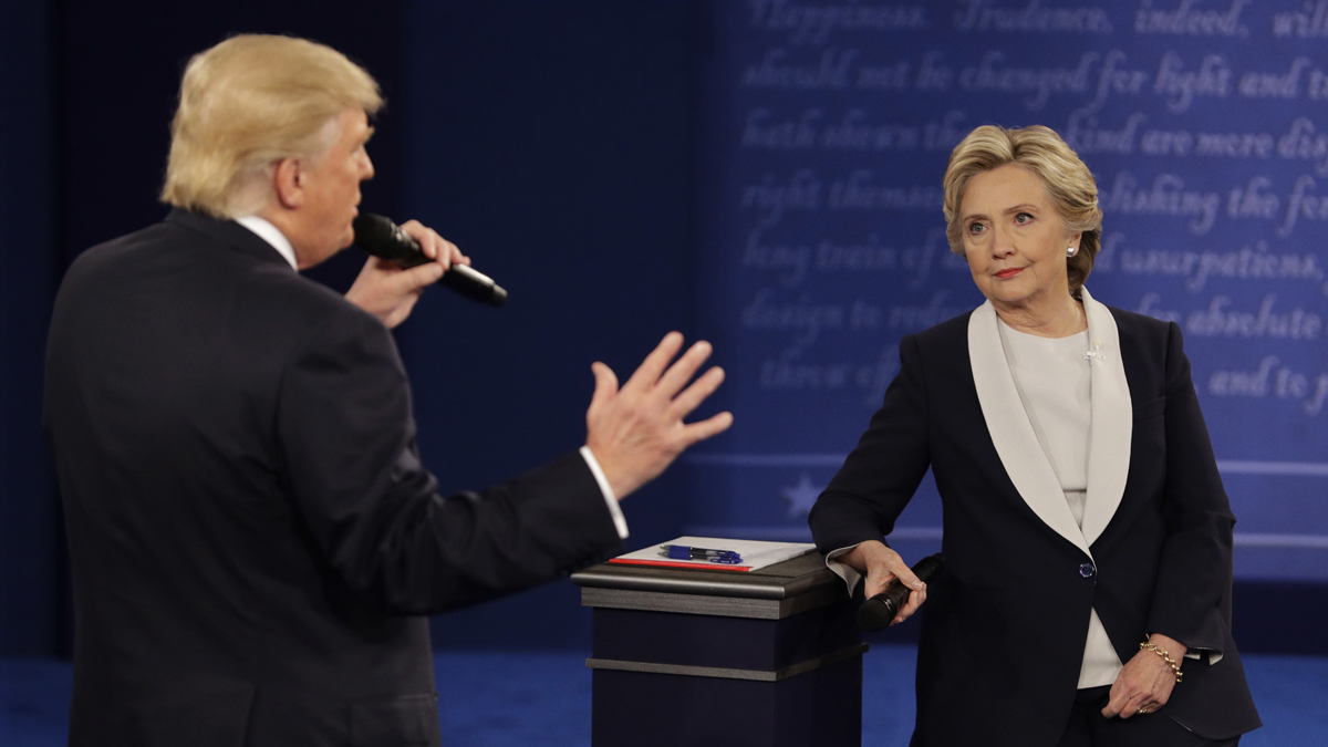 Democratic presidential nominee Hillary Clinton listens to Republican presidential nominee Donald Trump during the second presidential debate at Washington University in St. Louis