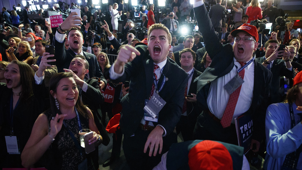 Supporters of Republican presidential candidate Donald Trump cheer as they watch election returns during an election night rally