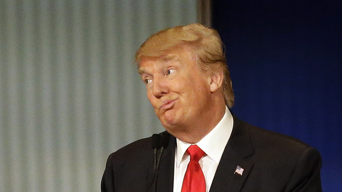  Donald Trump reacts during Republican presidential debate at Milwaukee Theatre, Tuesday, Nov. 10, 2015, in Milwaukee. (AP Photo/Jeffrey Phelps) 