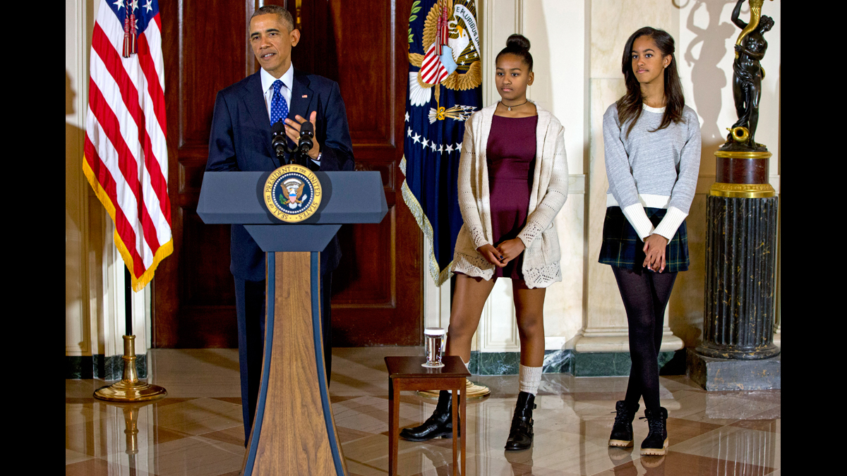  In this Nov. 26, 2014 file photo, President Barack Obama, joined by his daughters Malia, (right), and Sasha, speaks at the White House, in Washington during the presidential turkey pardon ceremony, an annual Thanksgiving tradition.(Jacquelyn Martin/AP Photo, file) 