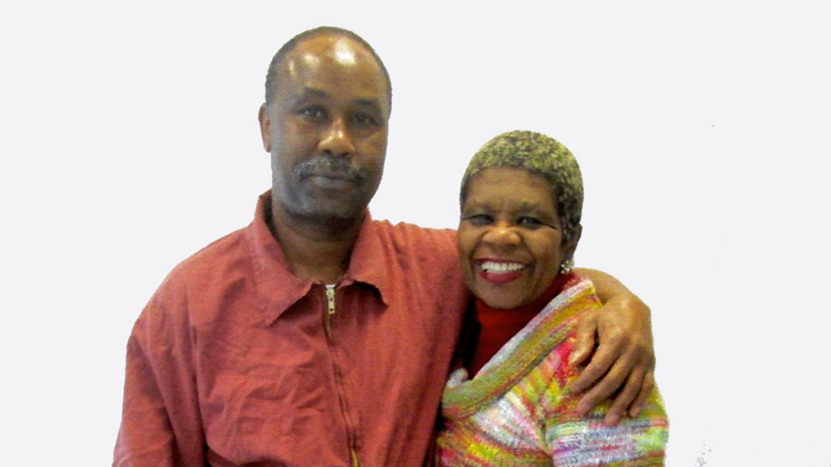 Tyrone Jones poses with his arm around his sister