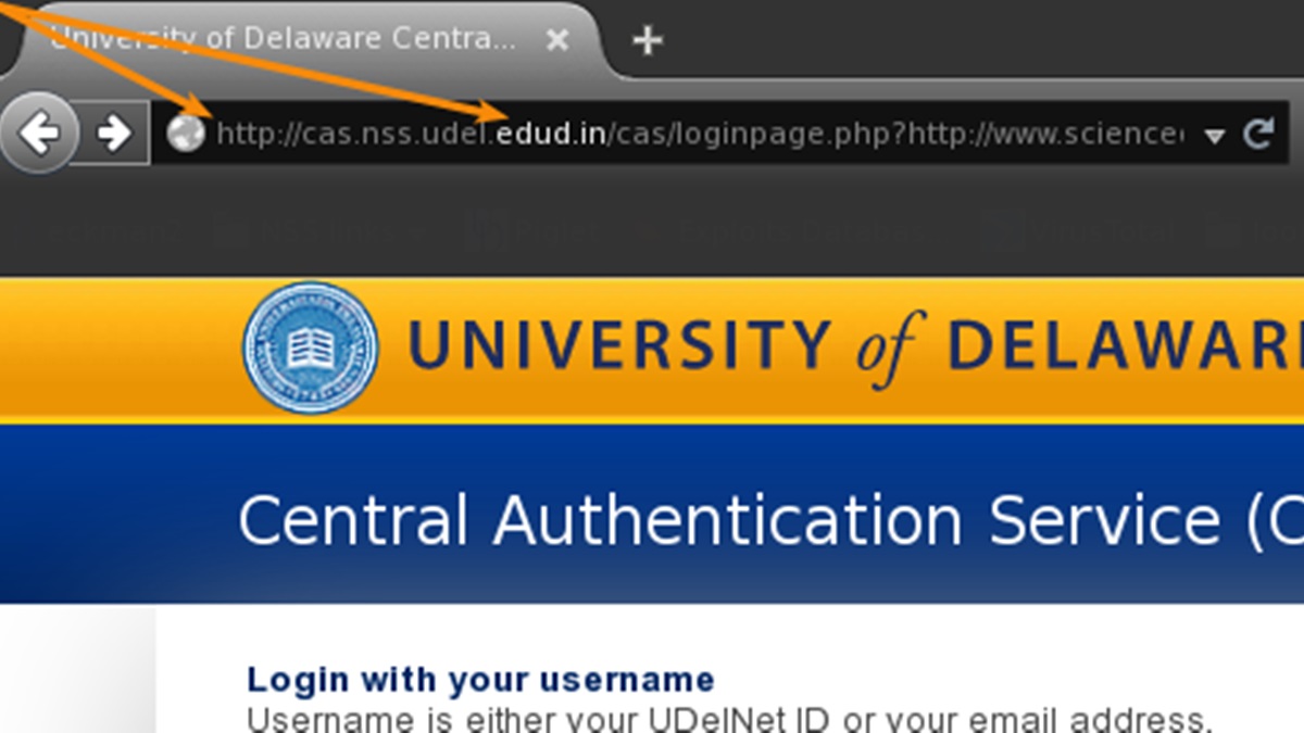 The two arrows point to telltale signs this page is scammed copy of a UD login screen. (photo courtesy UDel.edu)