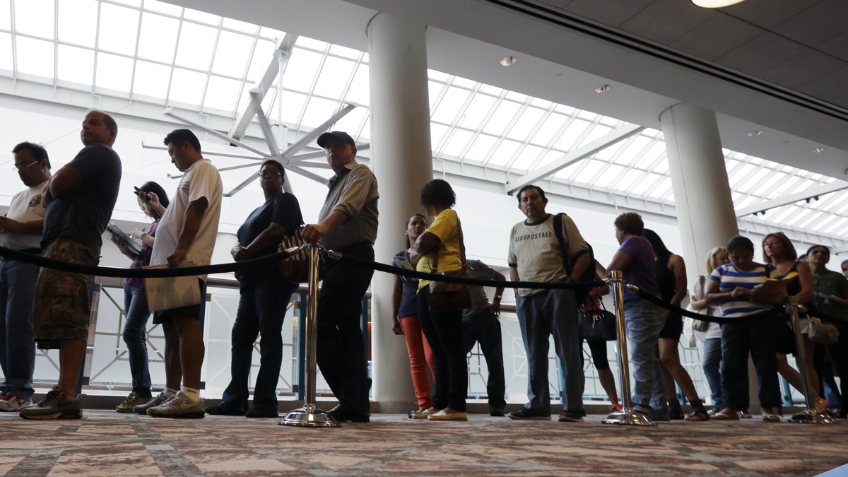  Job seekers are silhouetted while waiting in line to attend a career fair put on by National CareerFairs in San Jose, Calif in 2010. (AP Photo/Eric Risberg,file) 