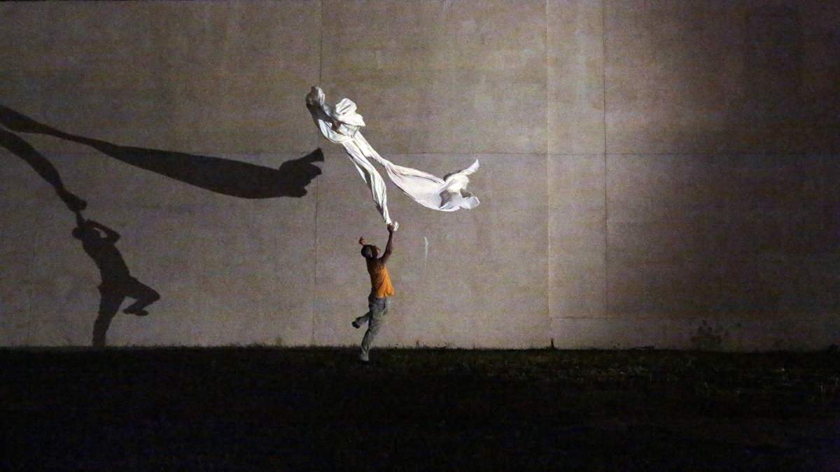 Jungwoong Kim rehearses a pop-up dance to be performed Thursday night in the now-vacant lot where a Salvation Army thrift store collapsed in 2013