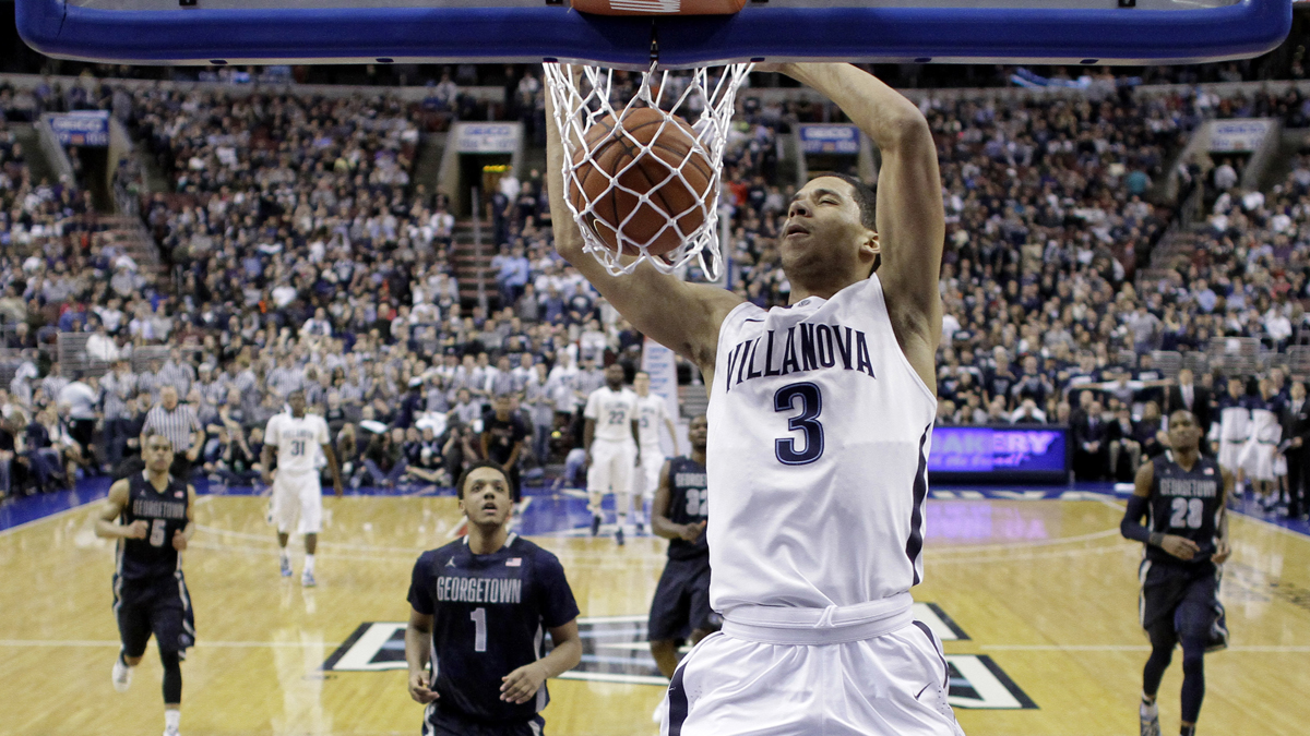 Villanova's Josh Hart dunks the ball during the first half of an NCAA college basketball game against Georgetown