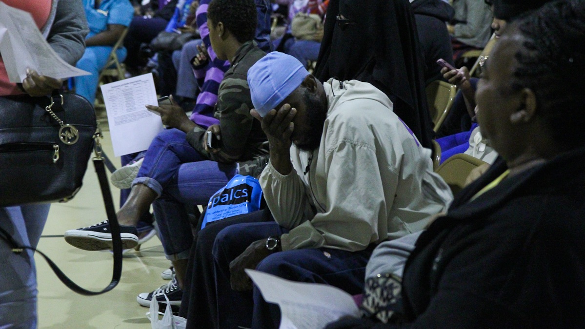 Mhsin Tisdale anxiously waits to hear his daughter's name called at the Walter Palmer Lottery Thursday. (Kimberly Paynter/WHYY)